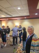 Coach Ryan Heller greeting the Magnificent Seven